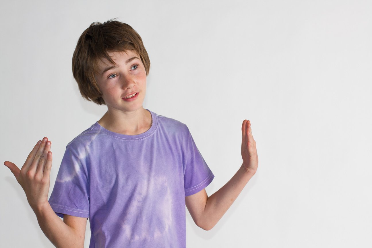 13 Y.O. Boy wearing Tie Dye Tshirt with Hands Out