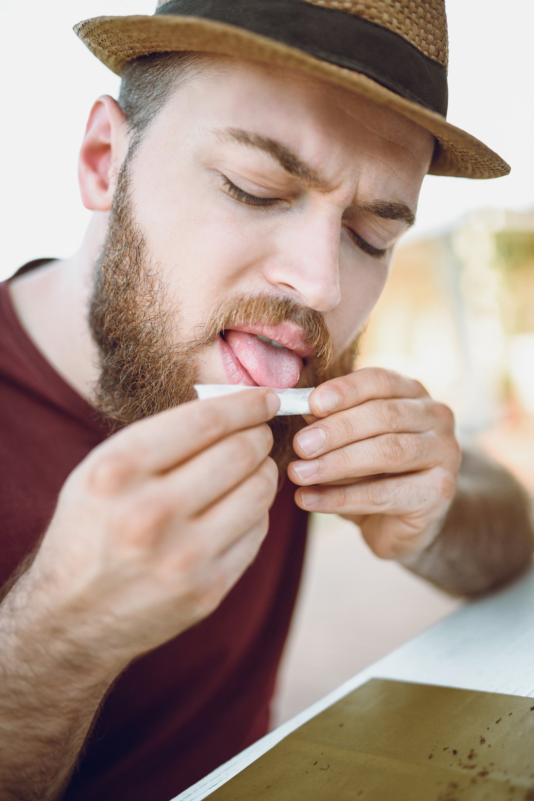 Rizla Licking Hipster Is Preparing A Joint